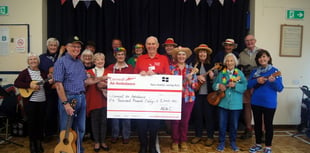 Ukulele band make £5,000 donation to Air Ambulance