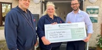 Care home make financial donation to health charity