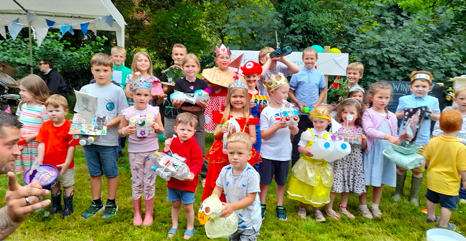 The children with their model rafts ready for the race along the river Lynher to the bridge at the Rilla Mill Village hall Summer Fayre.