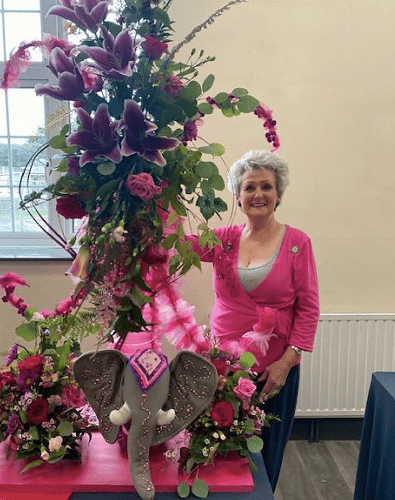 Susan Griffiths with her pink creation at Bude flower club