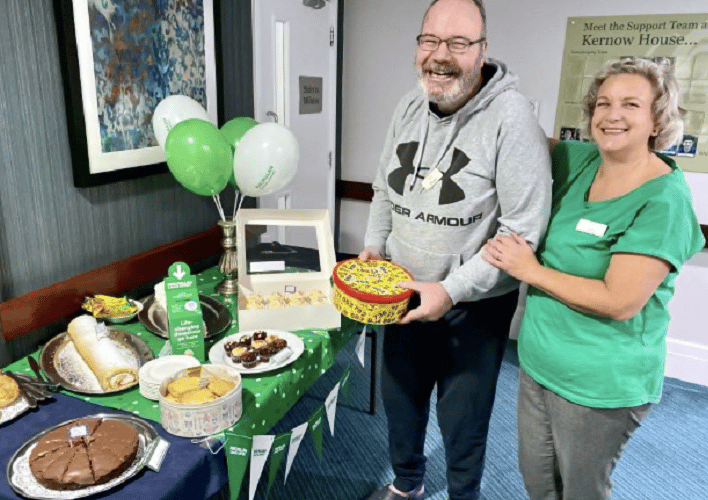 Richard and Jackie choosing which cakes to have at Kernow House Care Home’s coffee morning for Macmillan Cancer Research