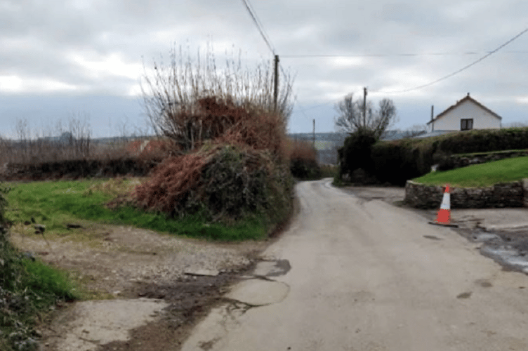 The field, left, where the houses would be built on the approach to Harrowbarrow, near Callington