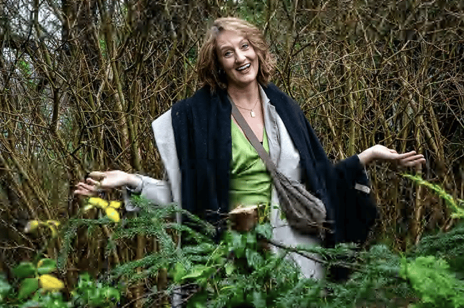 Sarah Yardley with the chopped down fir tree