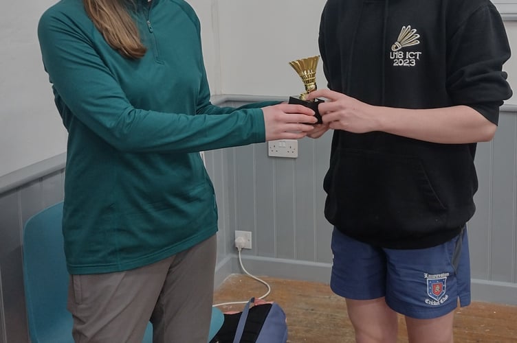 Finlay Worth being presented with his trophy by Lucy Ridgman.