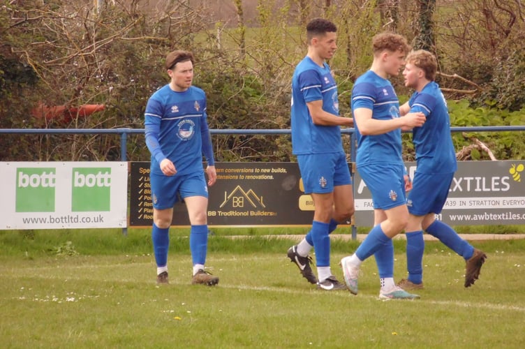 Bude Town celebrate their opening goal against Truro City Reserves on Monday afternoon