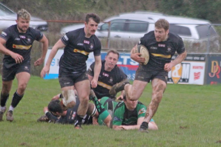 Launceston's Charlie Tummon, who scored a first half hat-trick, runs at the Ivybridge defence.