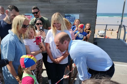 Prince William plays volleyball and meets lifeguards