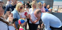 Prince William greeted by sunshine and crowds during visit