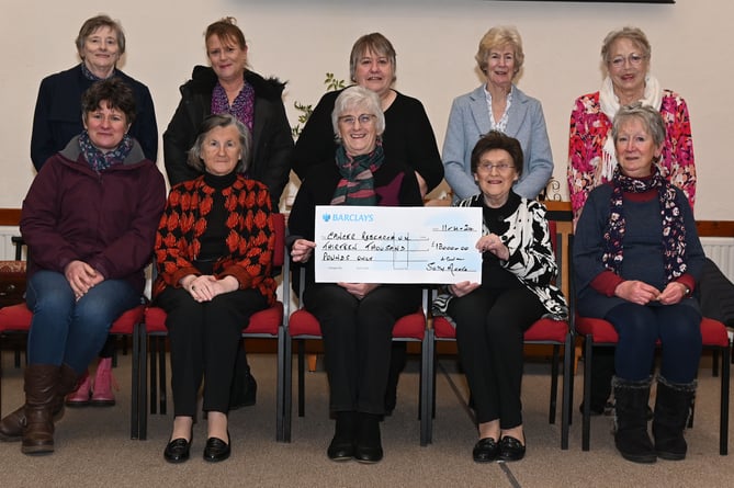 Proud of their achievement over the past year for raising the sum of £1,300 for Cancer Research UK are the members of the Camelford Committee of Cancer Research UK