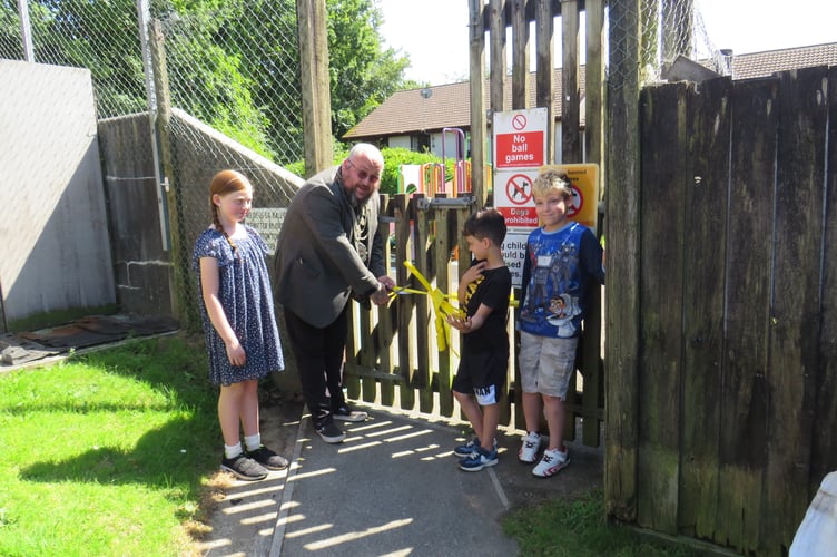 PORTREEVE Steve Pound and local children cut the ribbon on the revamped Rosemullion Gardens playpark