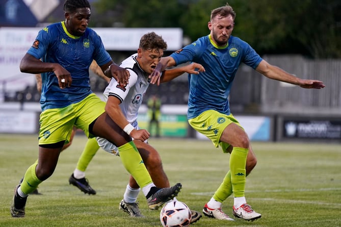 Truro's Seidou Sanogo (left) and Tom Harrison look to win the ball off the Salisbury attacker in Wiltshire. Picture: Michael Berkeley.