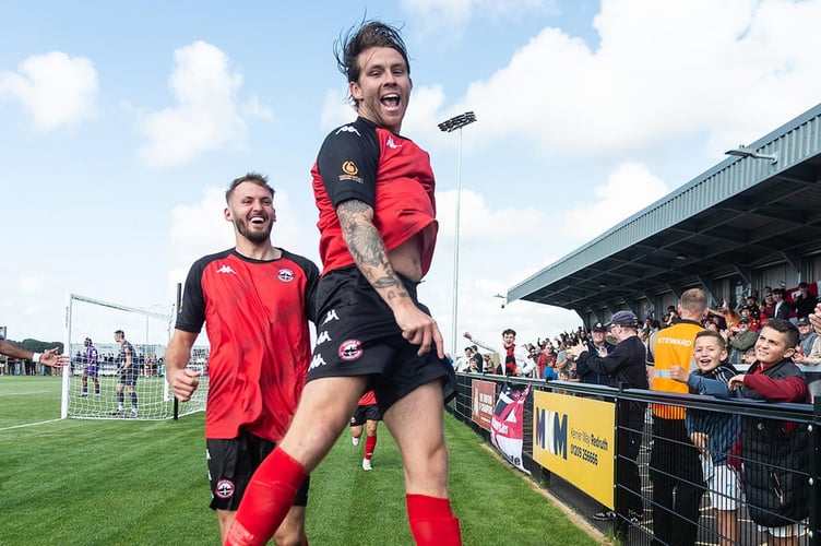 Tyler Harvey celebrates one of his two goals against Enfield Town on Saturday. Picture: Colin Bradbury