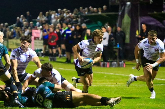 Scrum-half Cam Jones has centre Matt McNab in support as he snipes down the blindside. Picture: Brian Tempest