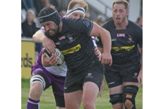 Flanker Lloyd Duke drives forward under pressure from the Exmouth defence. Picture: Paul Hamlyn