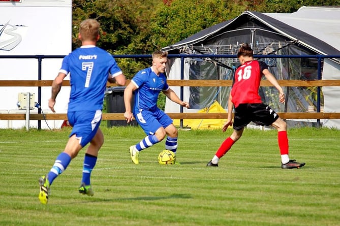 Bude Town's Rocco Dyer, pictured running at the Truro City Reserves defence, was part of the under 18s squad at Holsworthy and will be a big threat at Upcott Field. Pictures supplied by Bude Town AFC