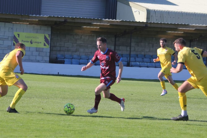 Launceston striker Andy Watkins, who made a goalscoring return to the side, runs at the Bridport defence. Picture: Paul Hamlyn