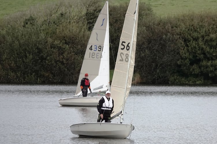 Solo sailors Adam Hilton and Dave Perrett stretch their legs in the super-light winds. Picture: Mandy Pollard