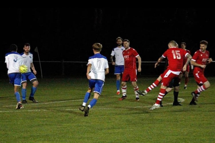 Bude Town debutant Joe Barker smashes home a superb shot from 25 yards to earn his side a point at Camelford on Friday night. Picture: Chris Pointer