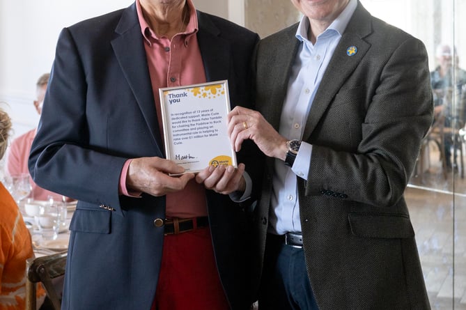 Marie Curie raise over Â£1M for Padstow to Rock swim, presentation by CEO Matthew Reed. Outgoing committee chairman Peter Tamblin, Lynda Thomas