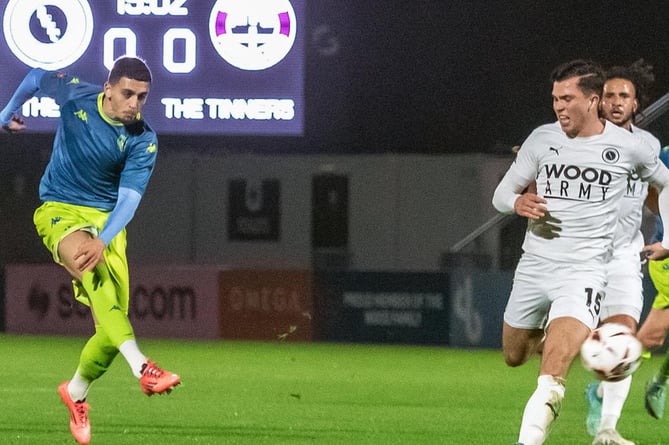 Jaze Kabia strikes at goal early on at Boreham Wood on Tuesday night. Picture: Colin Bradbury