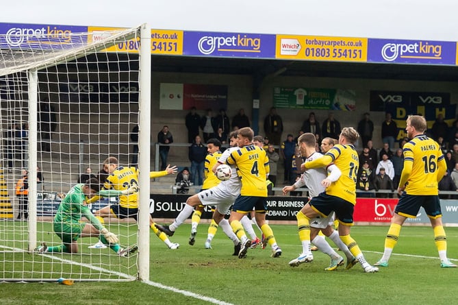 A scramble in the Torquay United box moments before Truro thought they had gone in front through skipper Connor Riley-Lowe. Picture: Colin Bradbury