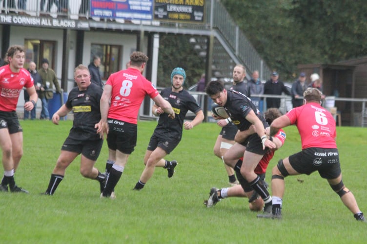 Launceston fly-half James Tucker looks to evade the attention of the Royal Wootton Bassett defence. Picture: Paul Hamlyn