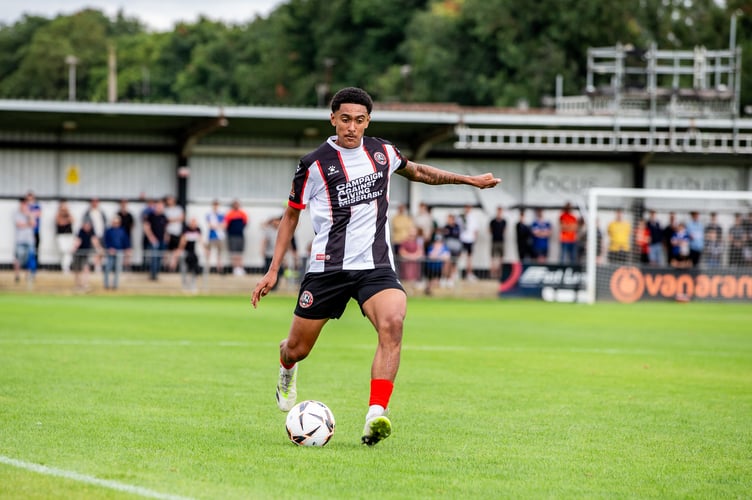 Truro City have signed defender Zac Bell on loan from Maidenhead United