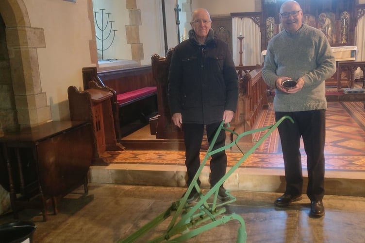 Rev Dr Paul Fitzpatrick Rector of Ashwater and Tony March a PCC member with one of the ploughs