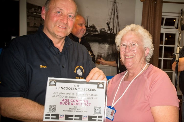 Bude and District Age Concern treasurer, Rosemary Lee, is pictured receiving a £500 donation from Simon of the Bencoolen Wreckers